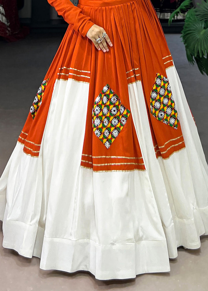 Vivid Tangerine &amp; White Rayon Navratri Lehenga Choli with Traditional Gamthi Motifs &amp; Gota Patti Accents