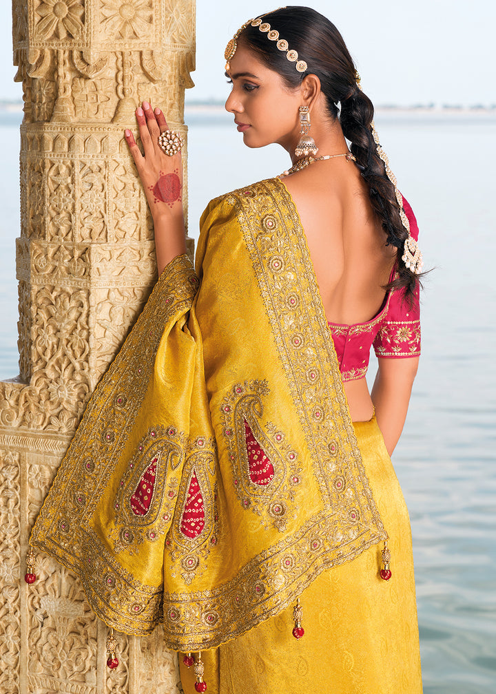 Saffron Yellow Crepe Silk Saree with Intricate Zari,Cut-Dana, Mirror and Zardosi Embellishments