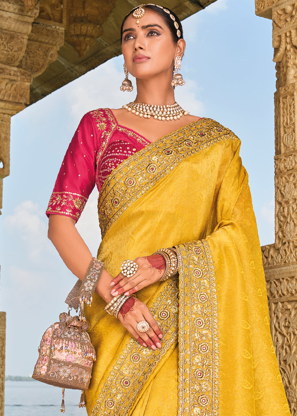 Saffron Yellow Crepe Silk Saree with Intricate Zari,Cut-Dana, Mirror and Zardosi Embellishments