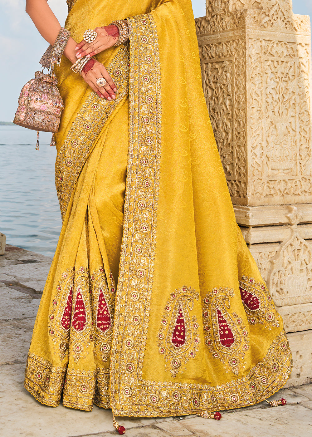 Saffron Yellow Crepe Silk Saree with Intricate Zari,Cut-Dana, Mirror and Zardosi Embellishments