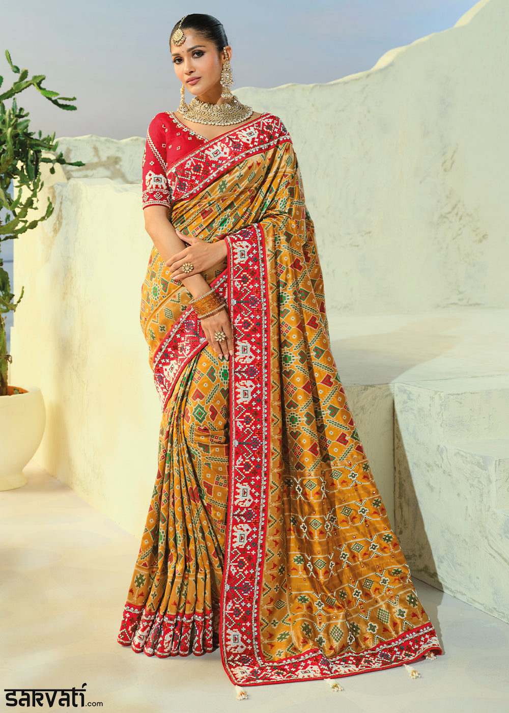 Mustard Yellow Patola Silk Designer Saree with Mirror, Cut-Dana and Pearl Embroidery