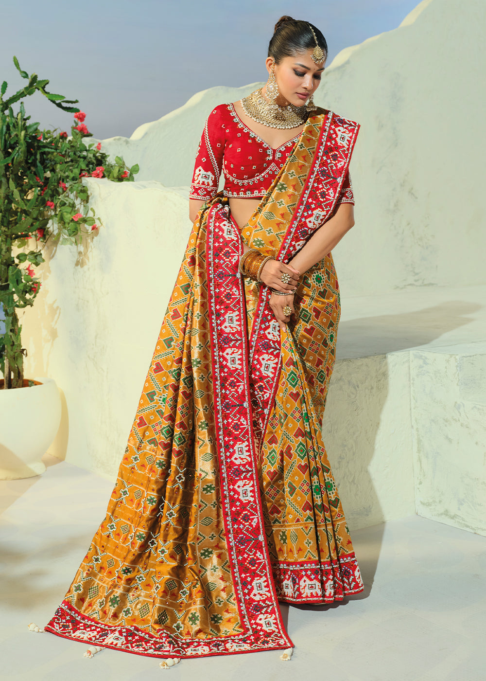 Mustard Yellow Patola Silk Designer Saree with Mirror, Cut-Dana and Pearl Embroidery