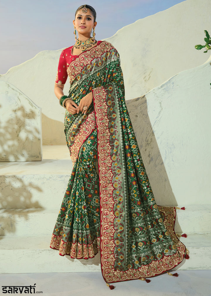 Bottle Green Designer Patola Silk Wedding Saree with Cut Dana and Mirror Embroidery
