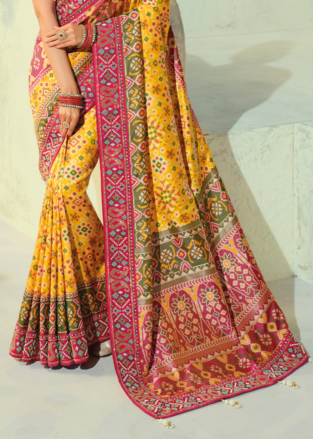 Golden Yellow and Fuchsia Pink Patola Silk Designer Saree with Cut-Dana and Mirror Embroidery