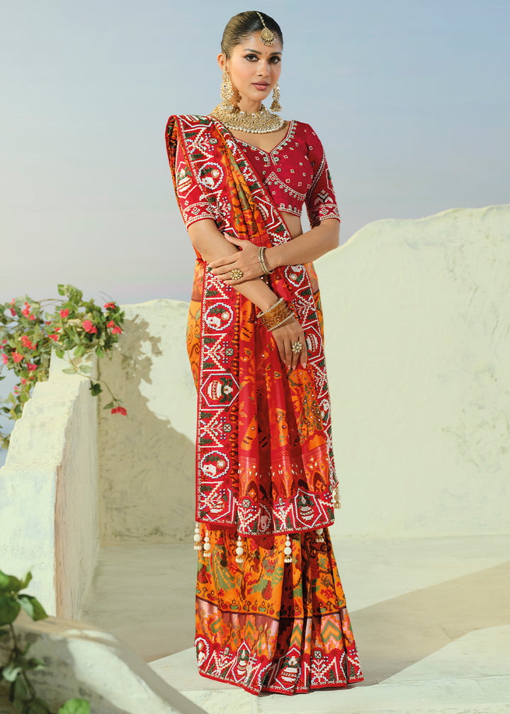 Marigold Orange and Red Patola Silk Designer Saree with Cut-Dana and Mirror Embroidery