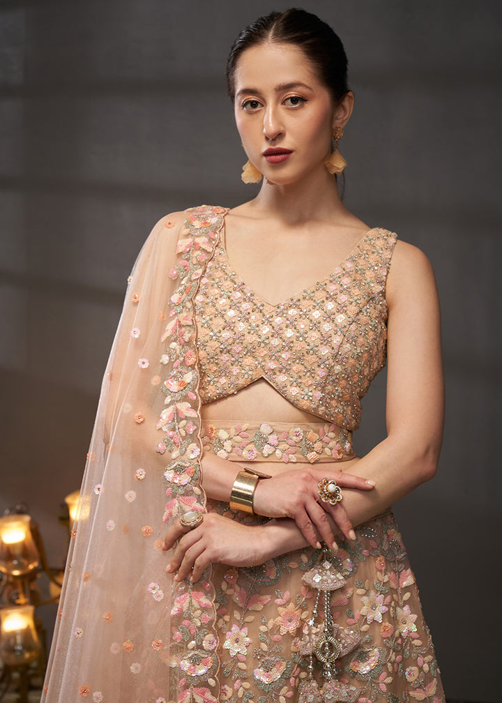 Creamy Peach Net Lehenga Choli with Heavy Sequin Threadwork, Floral Embroidery &amp; Embellished Belt