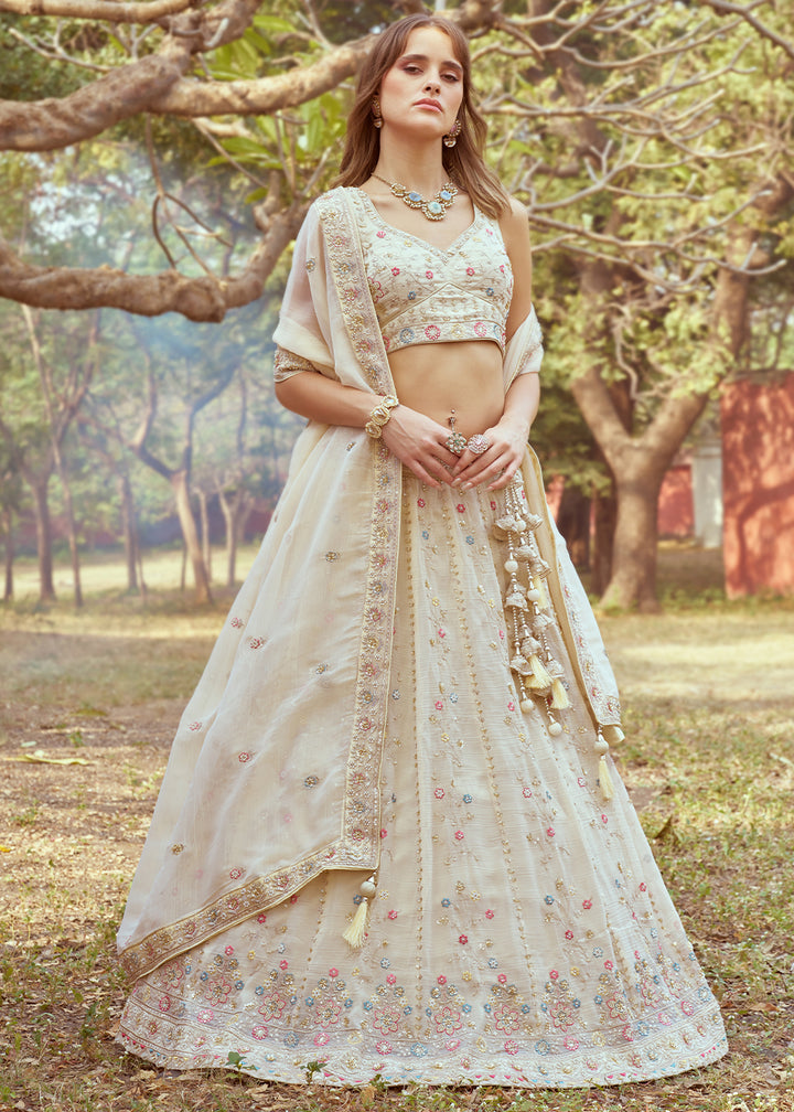 Cream White Lehenga Choli in Crushed Tissue with Charming Embroidery Work