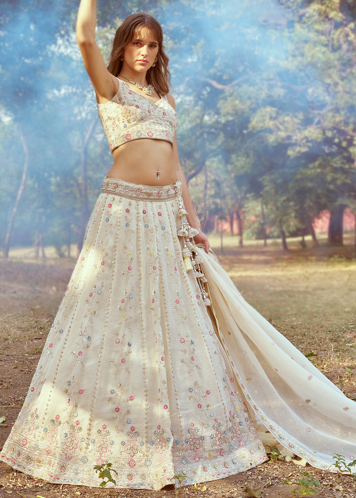 Cream White Lehenga Choli in Crushed Tissue with Charming Embroidery Work