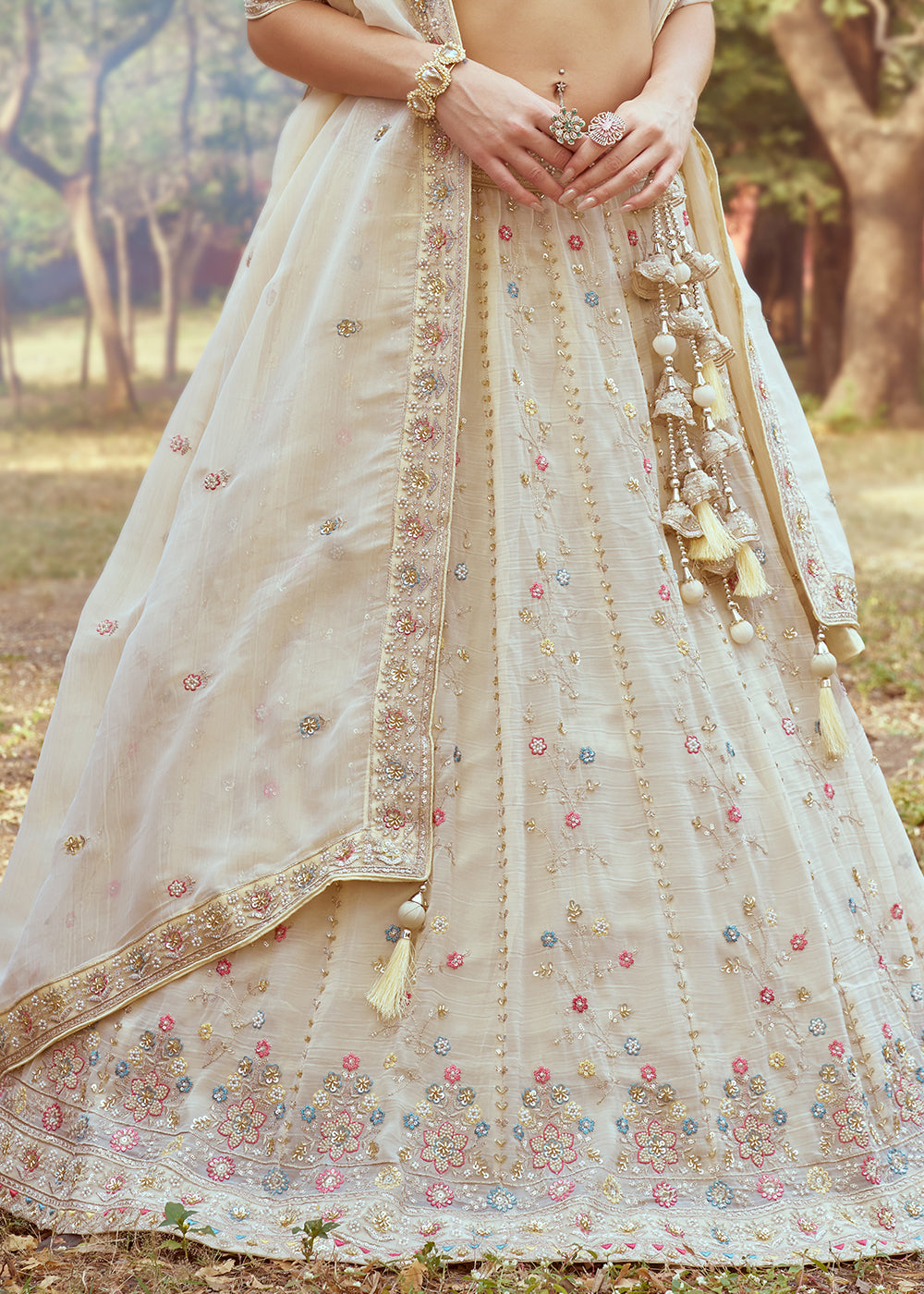 Cream White Lehenga Choli in Crushed Tissue with Charming Embroidery Work