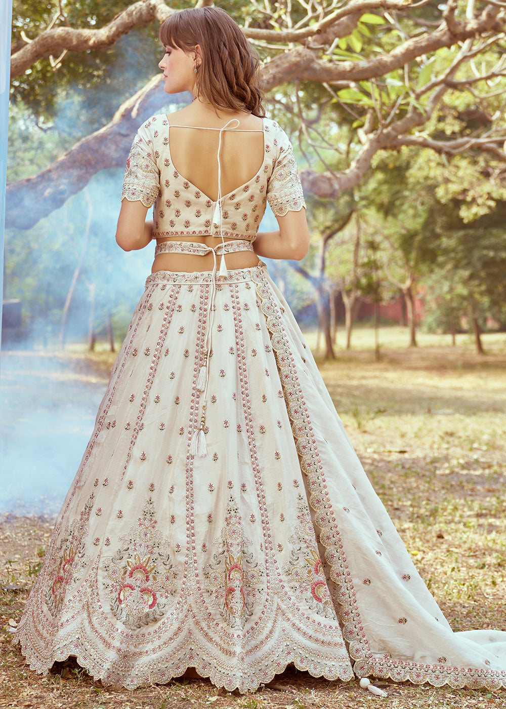 Parchment White Lehenga Choli in Crushed Tissue with Charming Embroidery Work