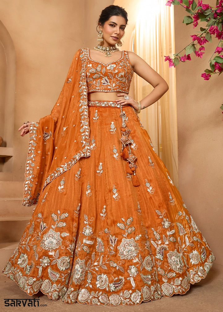 Pumpkin Orange Tissue Lehenga Choli with Handcrafted Floral & Sequin Work