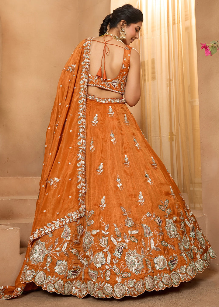 Pumpkin Orange Tissue Lehenga Choli with Handcrafted Floral & Sequin Work