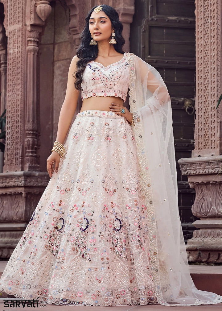 Woman in a traditional embroidered outfit standing in front of an architectural background