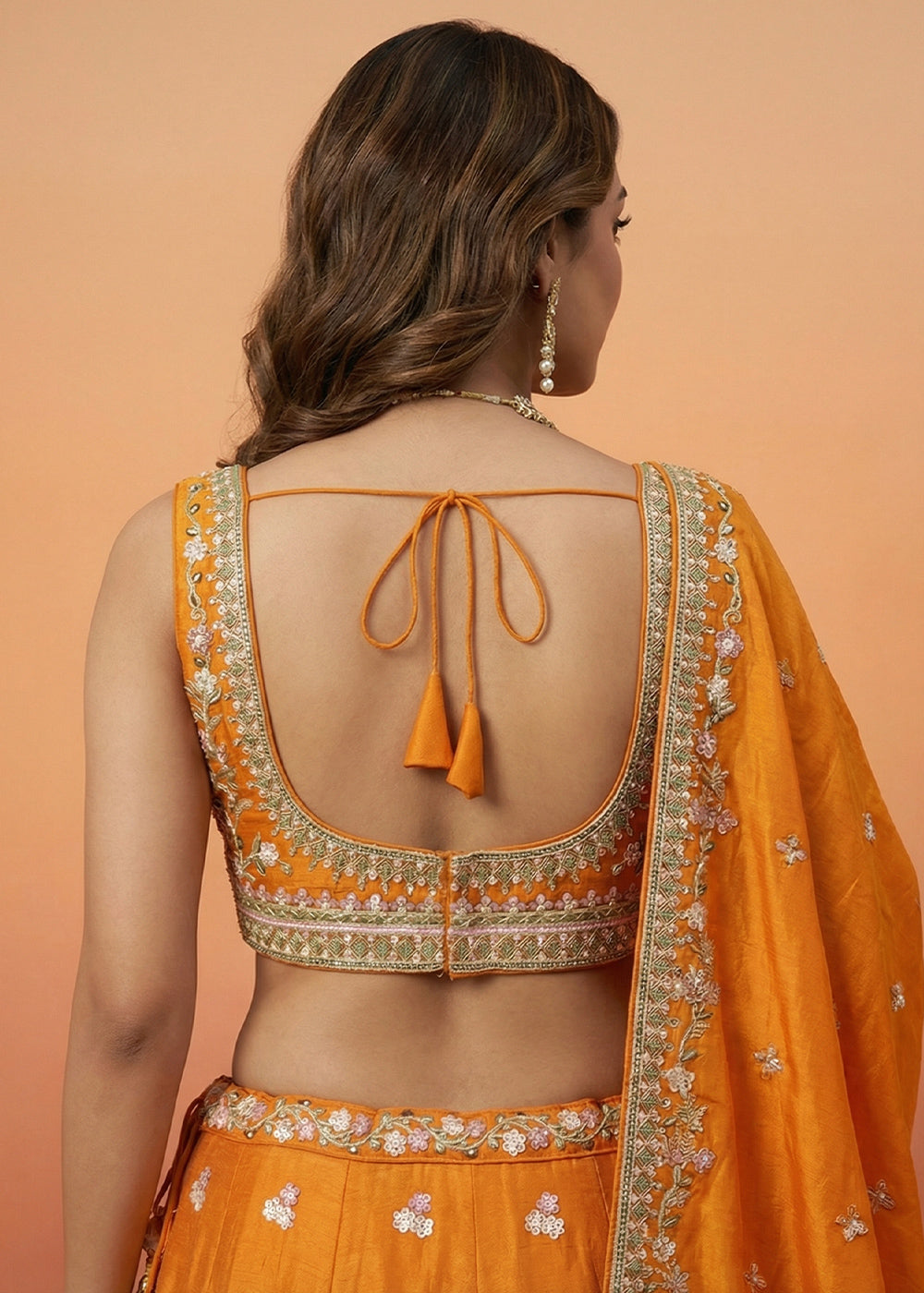 Orange Silk Blend Lehenga Choli with Nature-Inspired Embroidery