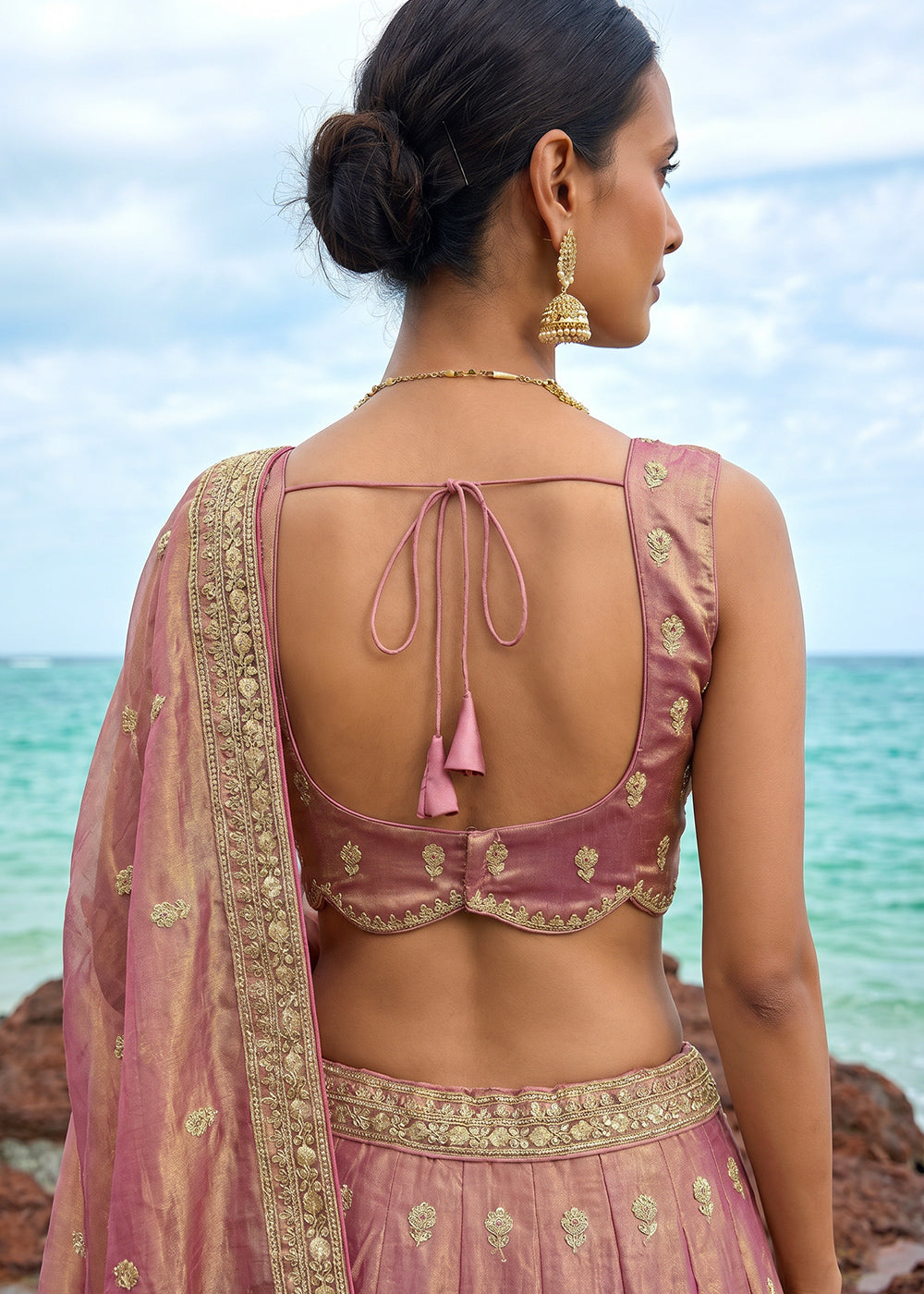 Pinkish Purple Gold Shimmer Tissue Lehenga Choli with Pearl & Zari Embroidered Motifs