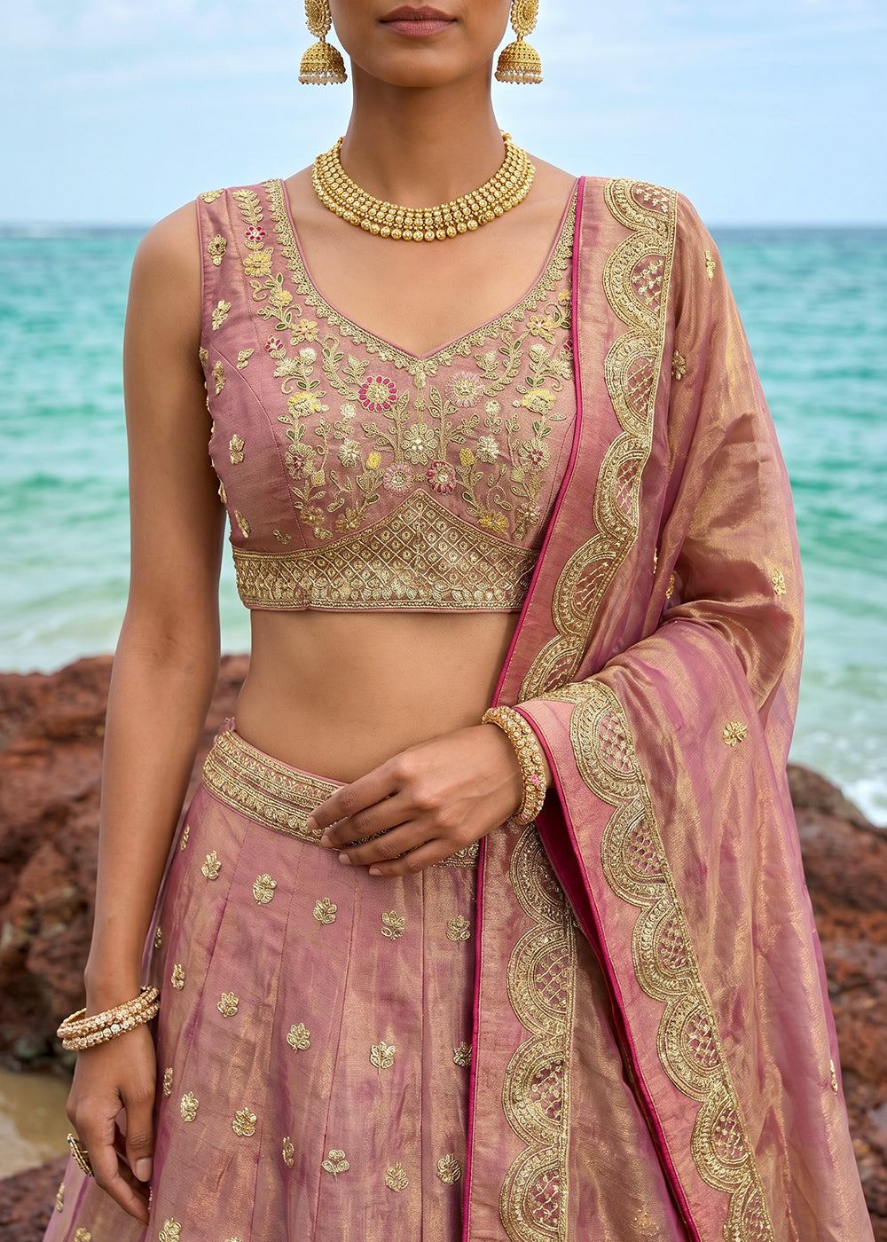 Pinkish Purple Gold Shimmer Tissue Lehenga Choli with Pearl &amp; Zari Embroidered Motifs