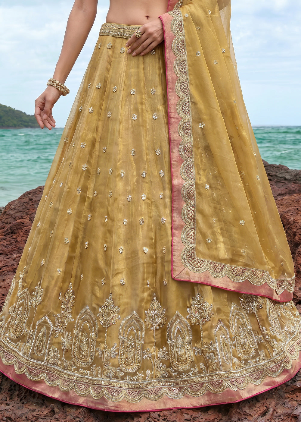 Antique Gold Yellow Tissue Lehenga Choli with Pearl and Zari Embroidered Motifs