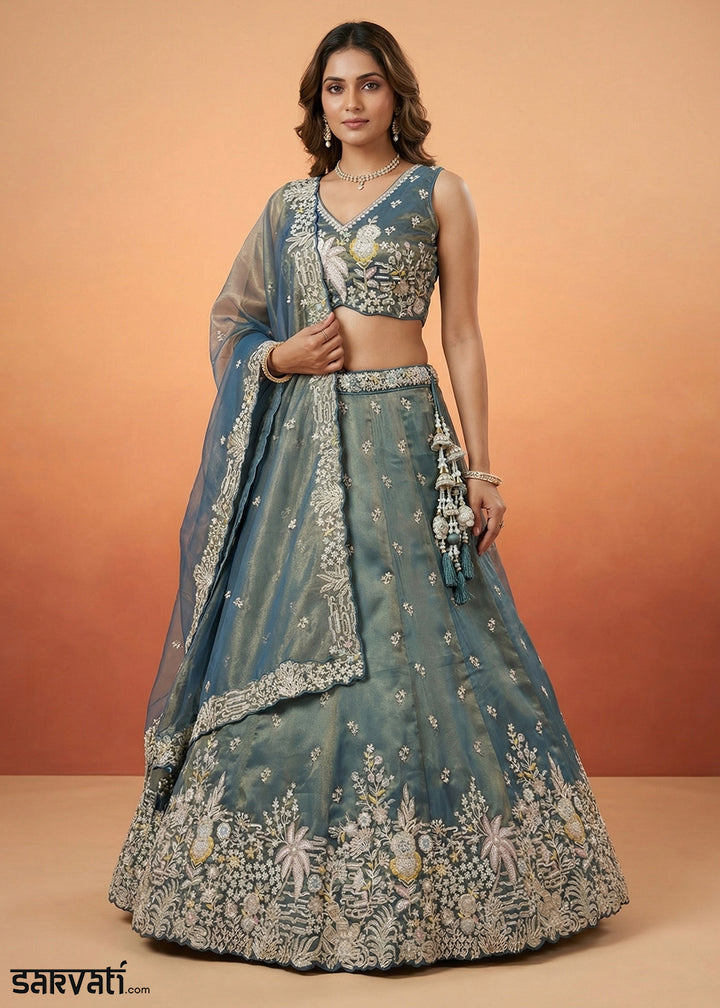 Deep Peacock Blue Tissue Lehenga Choli with Gold Shimmer, Moti, Zari &amp; Floral Embroidery