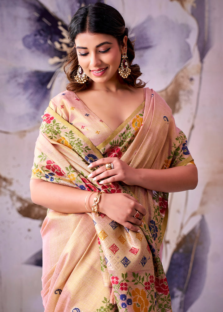 Tones of Pink Tissue Silk Saree with Intricate Floral Zari Motifs