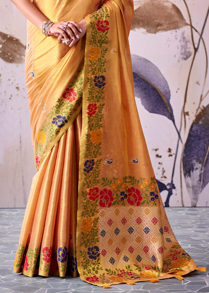 Tones of Orange Tissue Silk Saree with Intricate Floral Zari Motifs