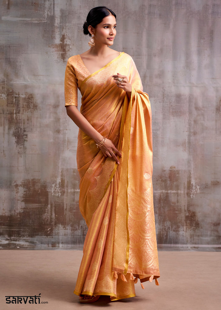 Tones Of Orange Tissue Silk Saree with Intricate Zari Artistry
