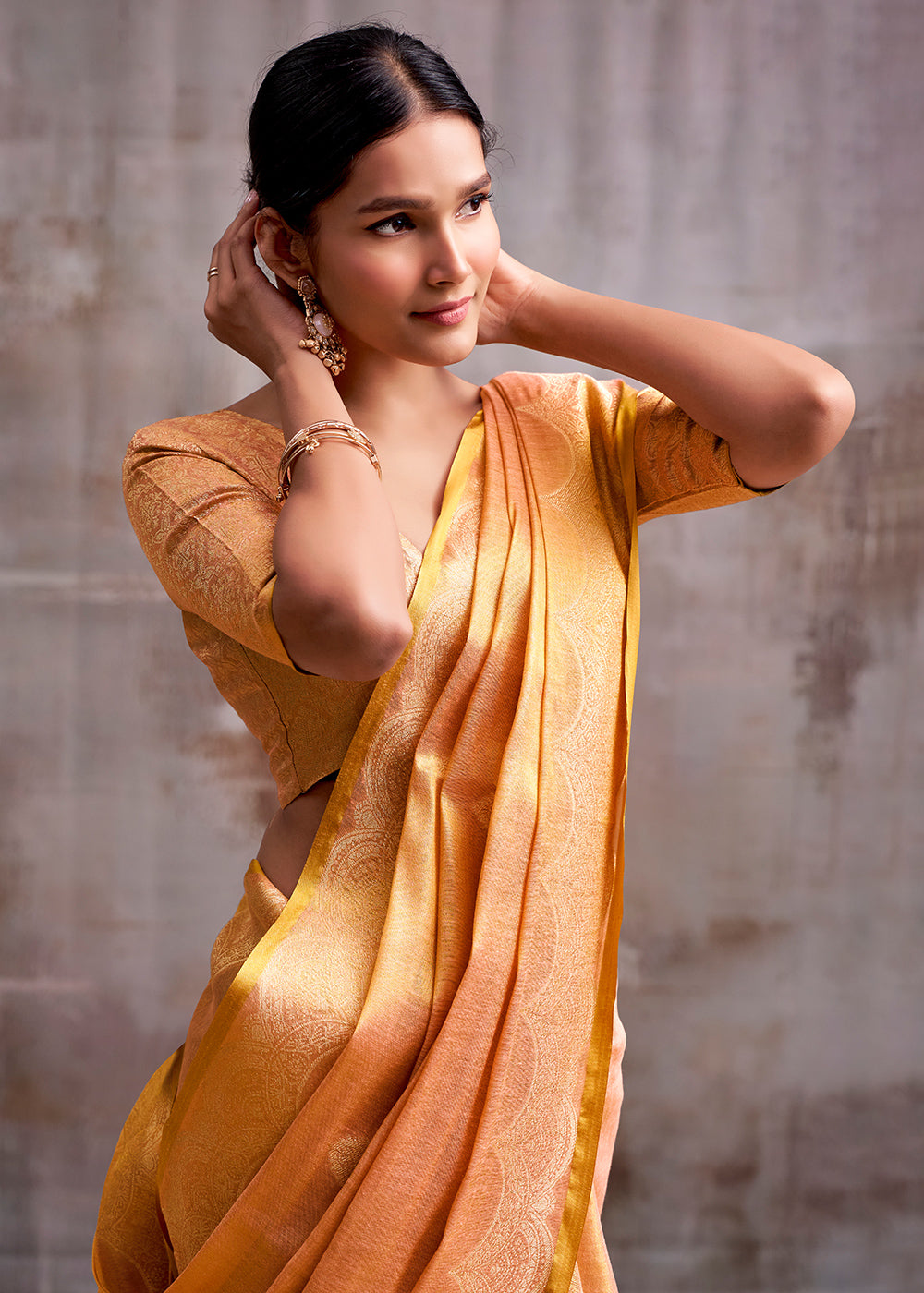 Tones Of Orange Tissue Silk Saree with Intricate Zari Artistry
