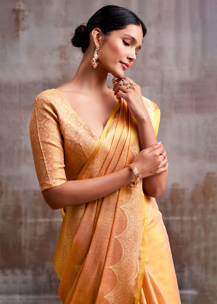 Tones Of Orange Tissue Silk Saree with Intricate Zari Artistry