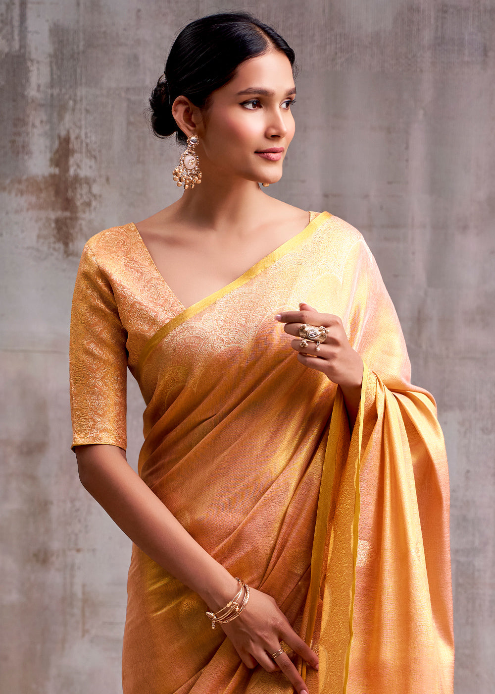 Tones Of Orange Tissue Silk Saree with Intricate Zari Artistry