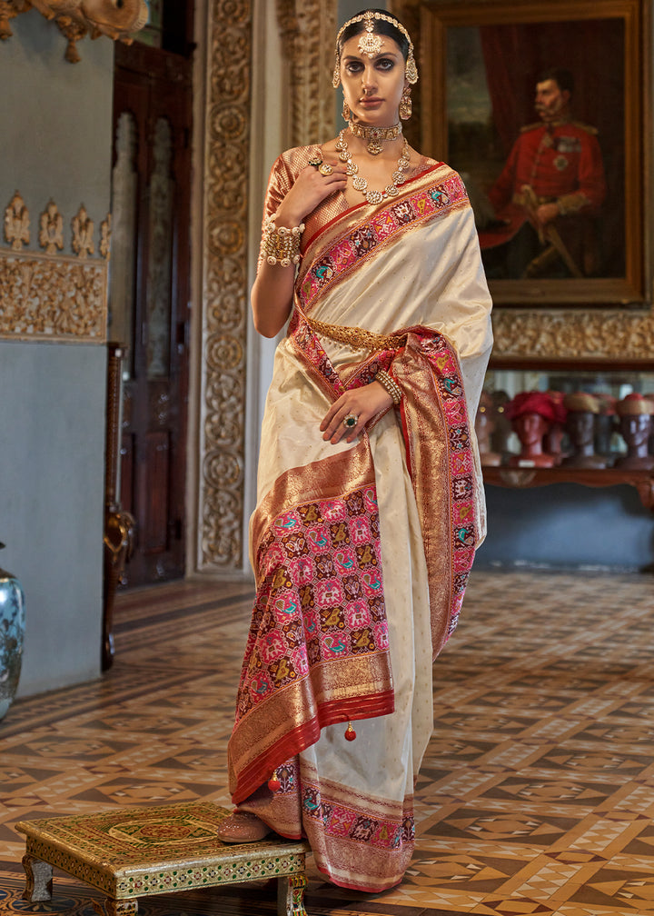 Pearl White Banarasi Silk Saree with Rich Patola Design and Zari Highlights