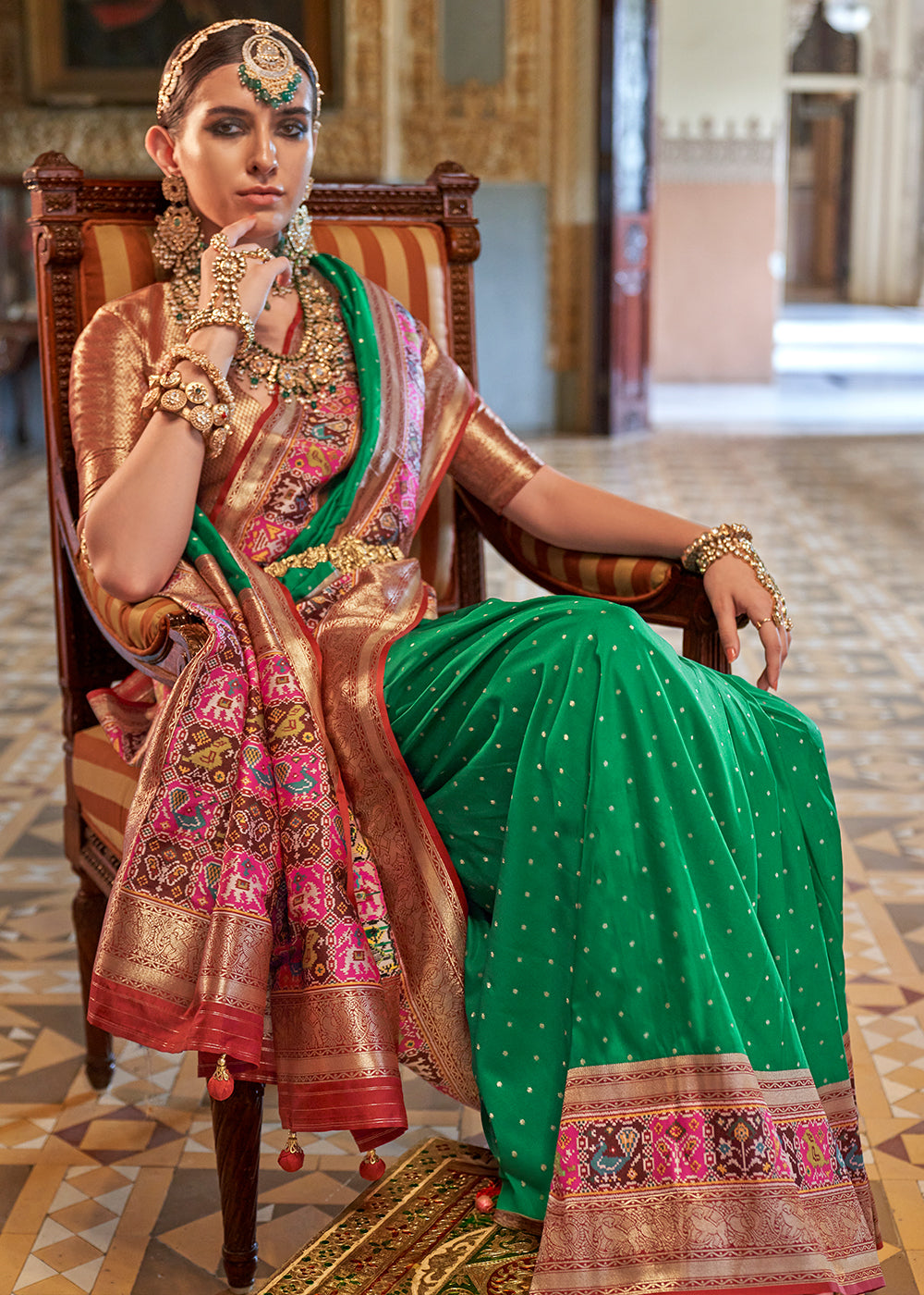 Jungle Green Banarasi Silk Saree with Rich Patola Design and Zari Highlights