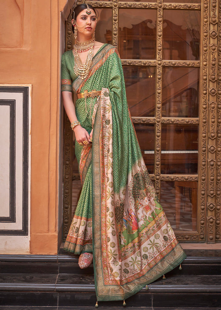 Pastel Green Silk Saree with Swarovski Embellishments and Unique Figure Motifs