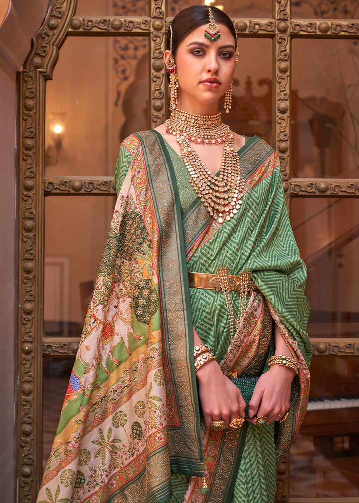 Pastel Green Silk Saree with Swarovski Embellishments and Unique Figure Motifs