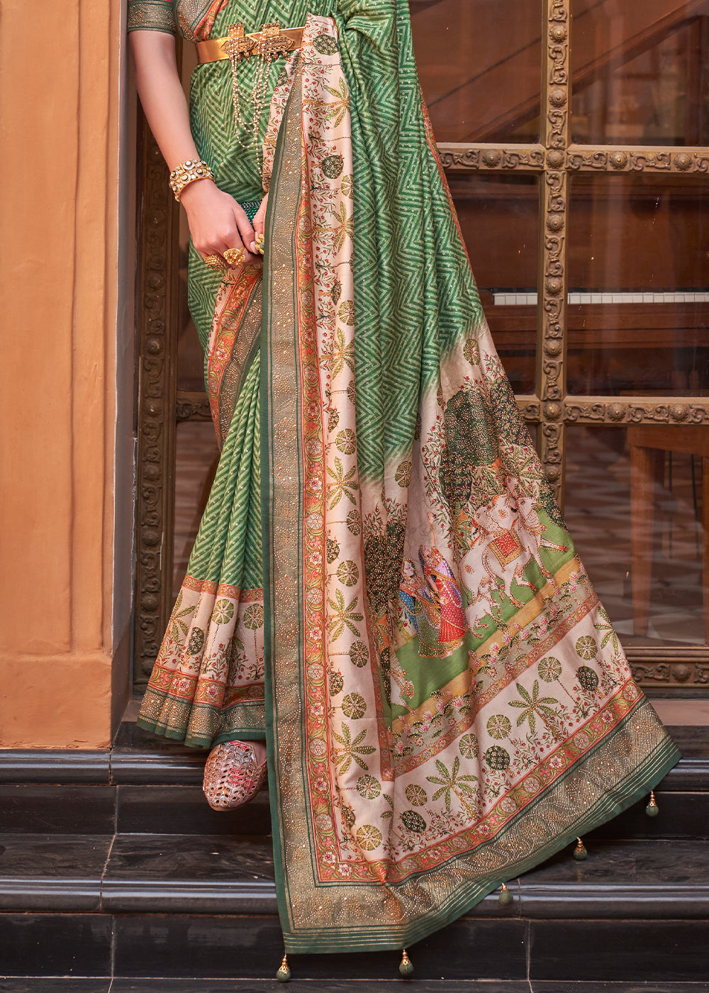 Pastel Green Silk Saree with Swarovski Embellishments and Unique Figure Motifs