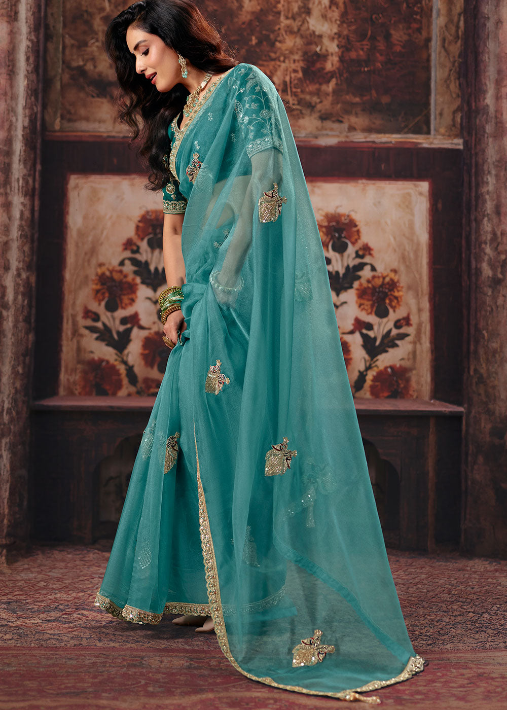 Teal Blue Organza Saree with Threadwork & Sequin Embellishments
