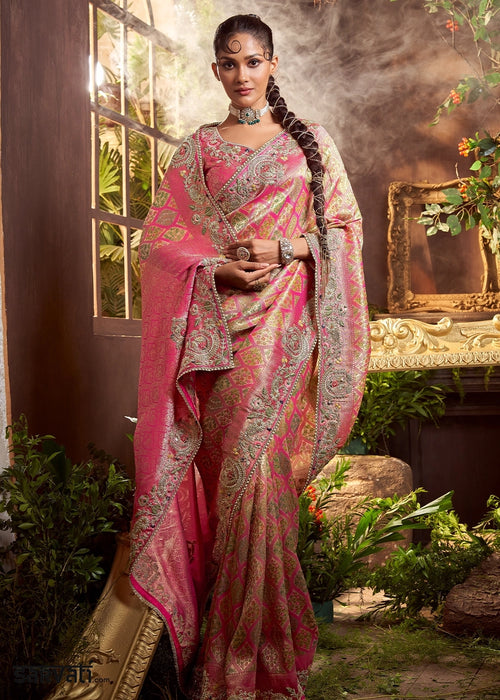 Pastel Pink Banarasi Silk Saree featuring Heavy Embroidery and Zari Detailing