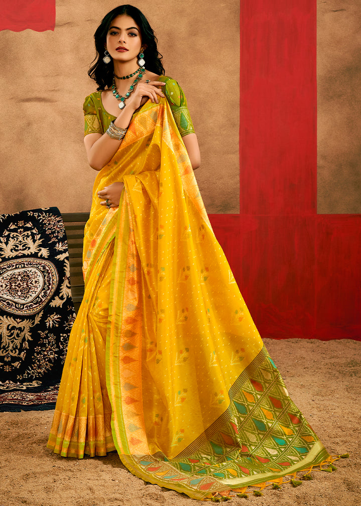 Saffron Yellow Patola Silk Saree with Intricate Design