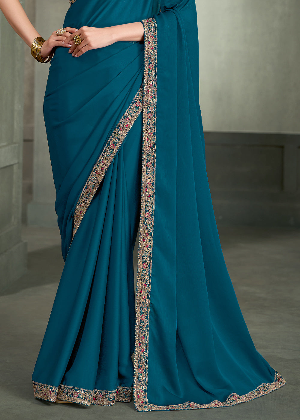 Teal Blue Crepe Silk Saree with Intricate Floral Embroidered Zari Border