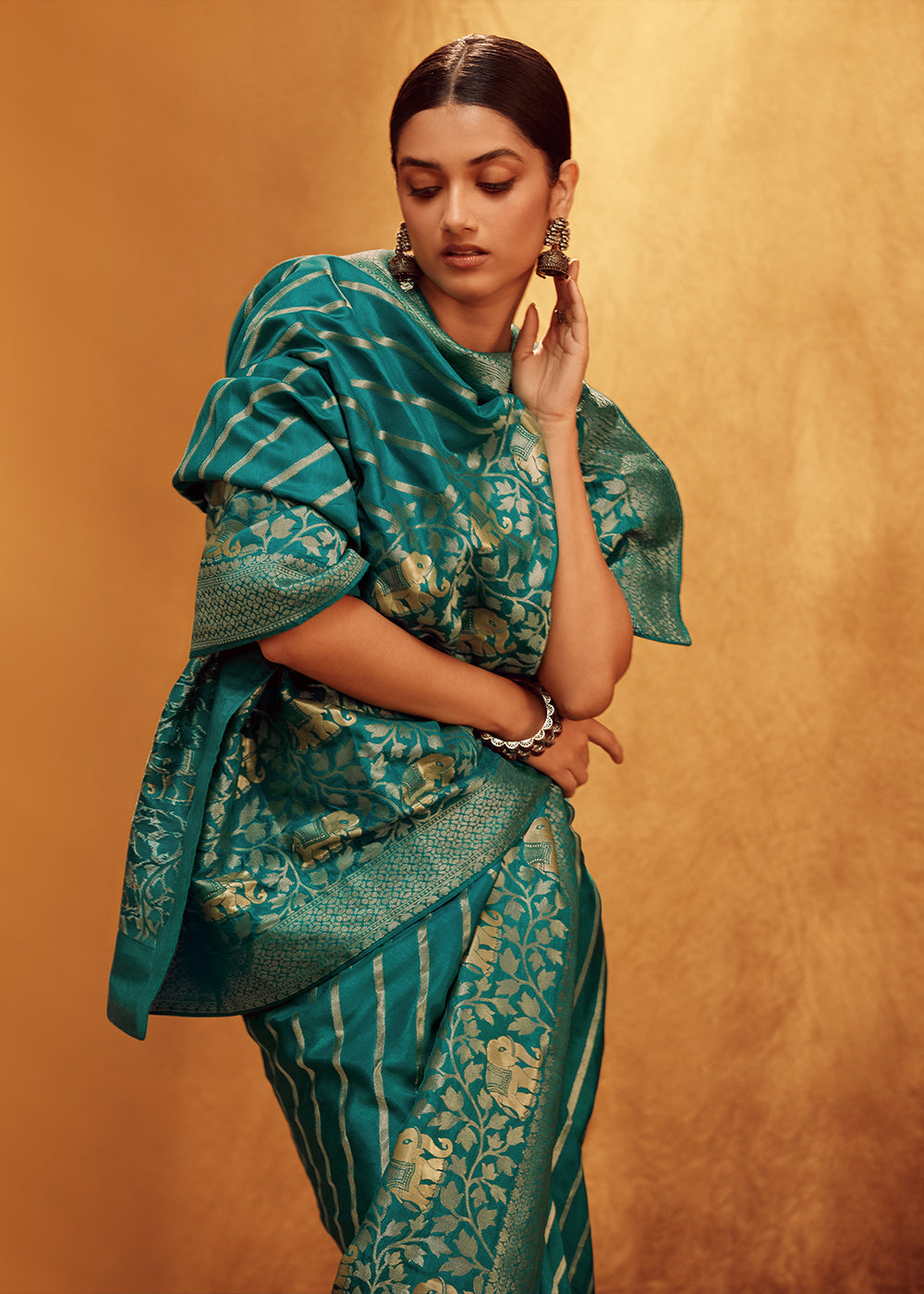 Teal Green Viscose Silk Saree Adorned with Zari Woven Detailing