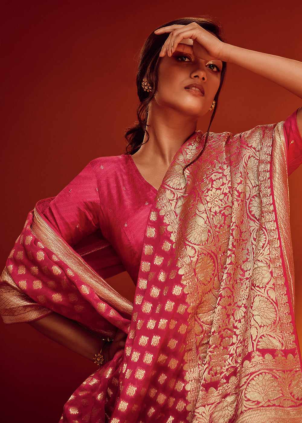 Carmine Pink Viscose Georgette Saree Adorned with Zari Woven Detailing