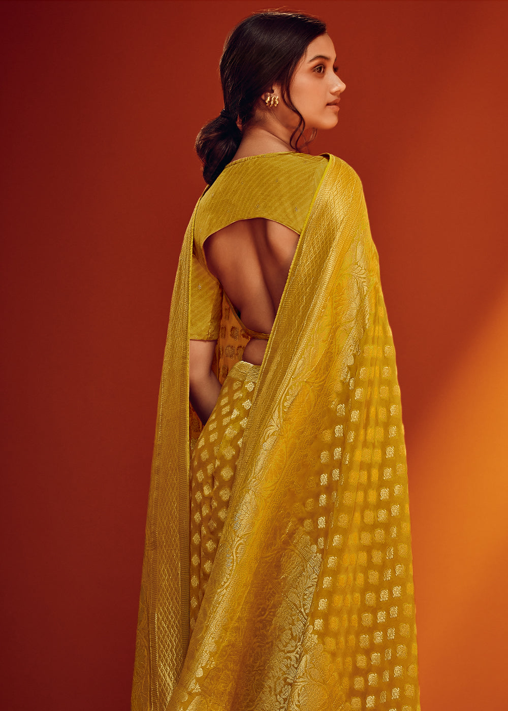 Shades Of Yellow Viscose Georgette Saree Adorned with Zari Woven Detailing