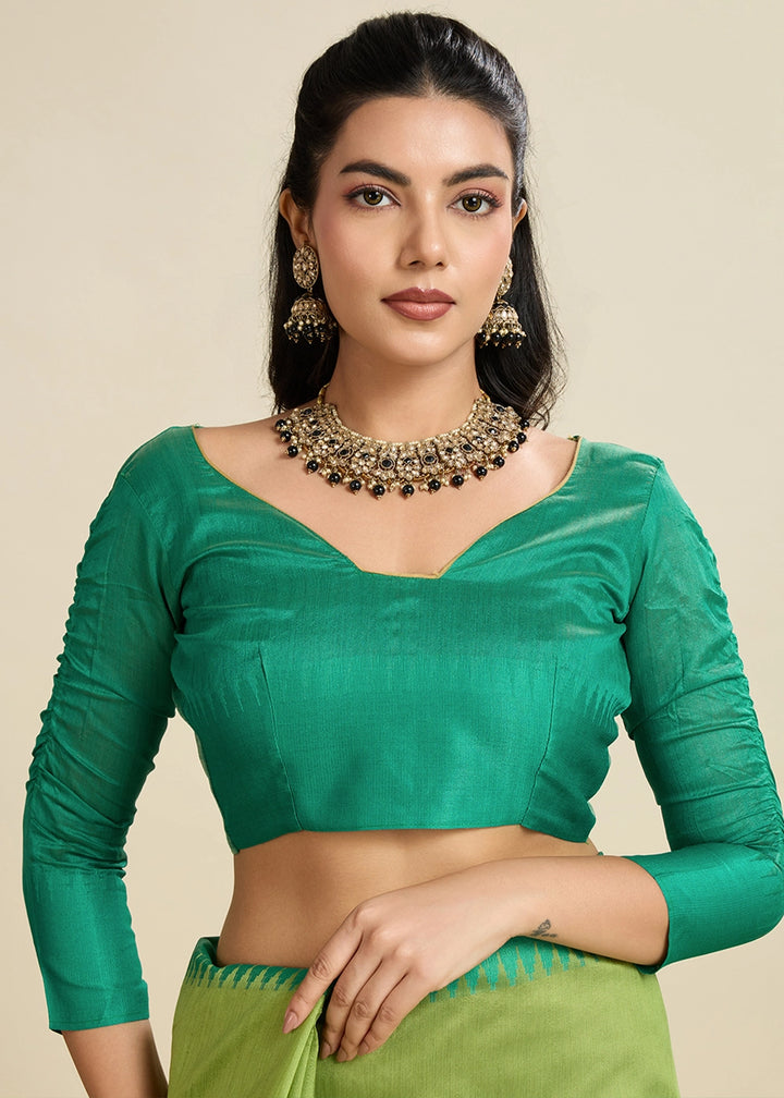 Limerick Green Raw Silk Saree Adorned with Temple Style Border