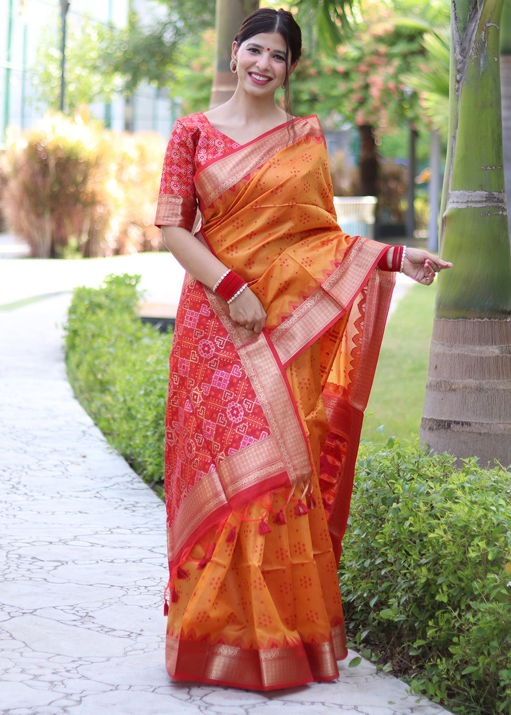 Pumpkin Orange Raw Silk Saree with Intricate Patola Print & Zari Pallu