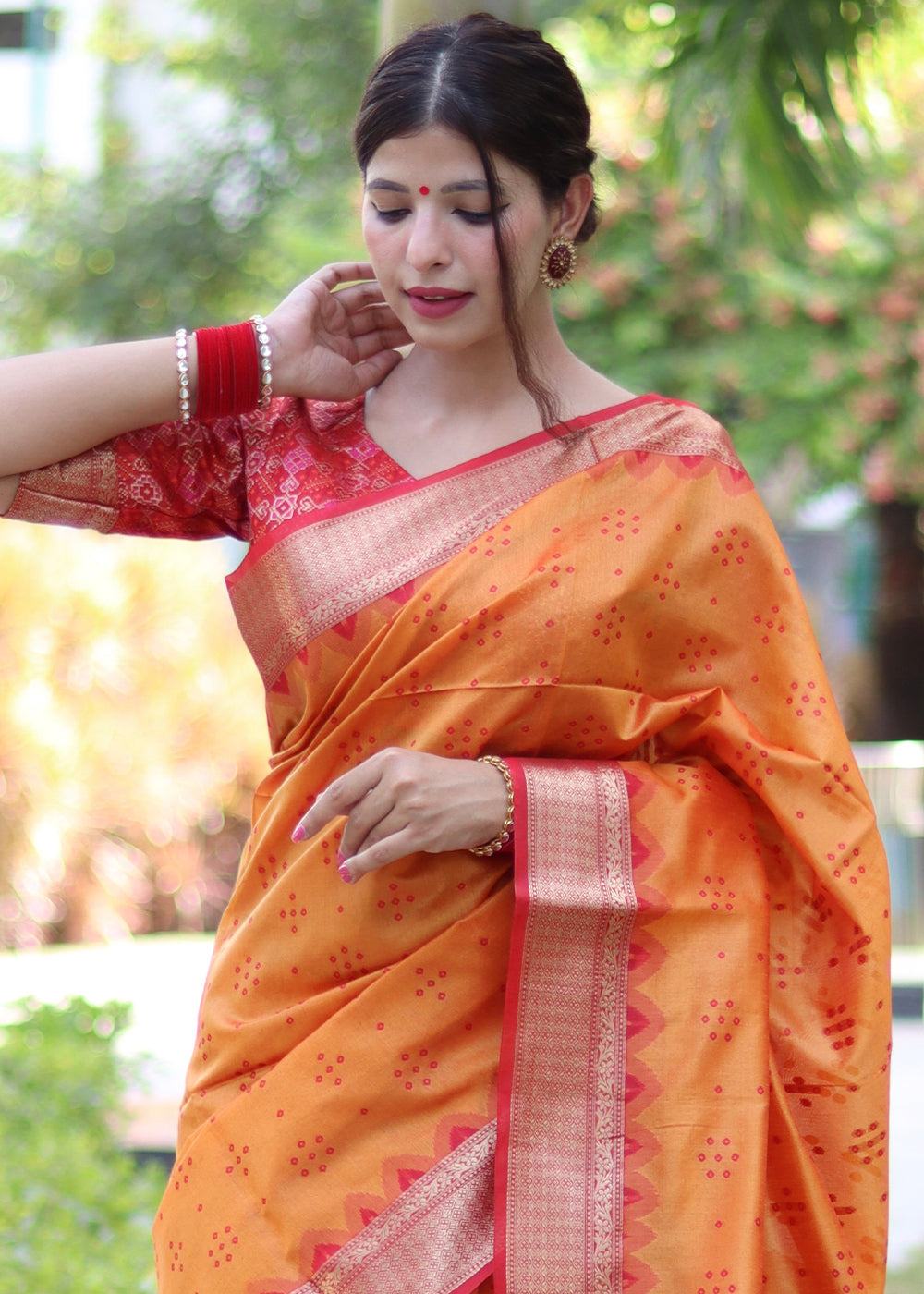 Pumpkin Orange Raw Silk Saree with Intricate Patola Print & Zari Pallu