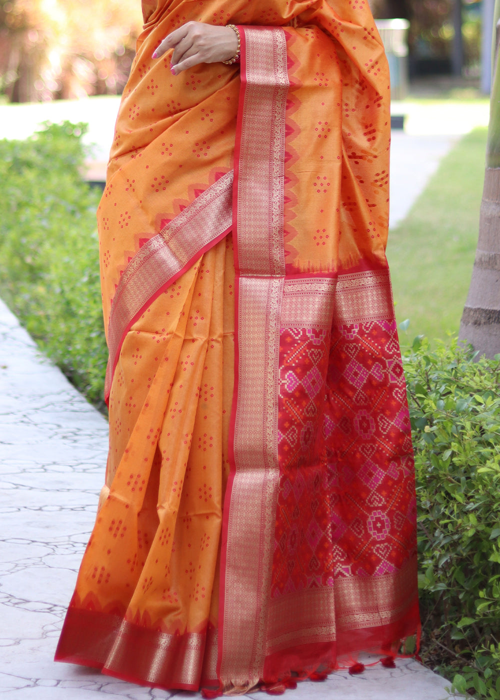 Pumpkin Orange Raw Silk Saree with Intricate Patola Print & Zari Pallu