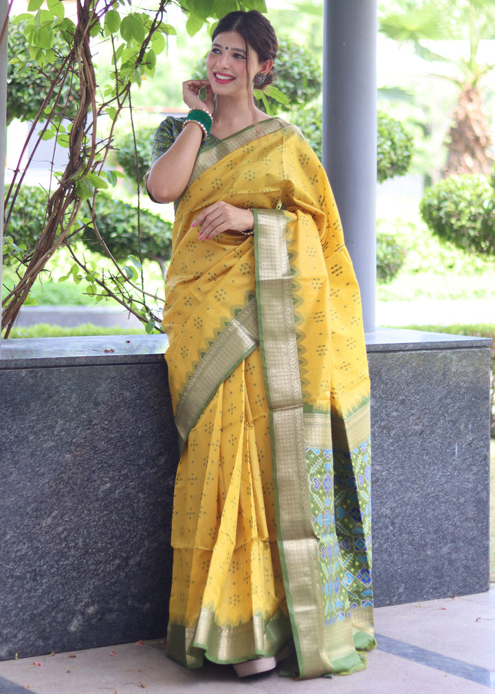 Aureolin Yellow Raw Silk Saree with Intricate Patola Print & Zari Pallu