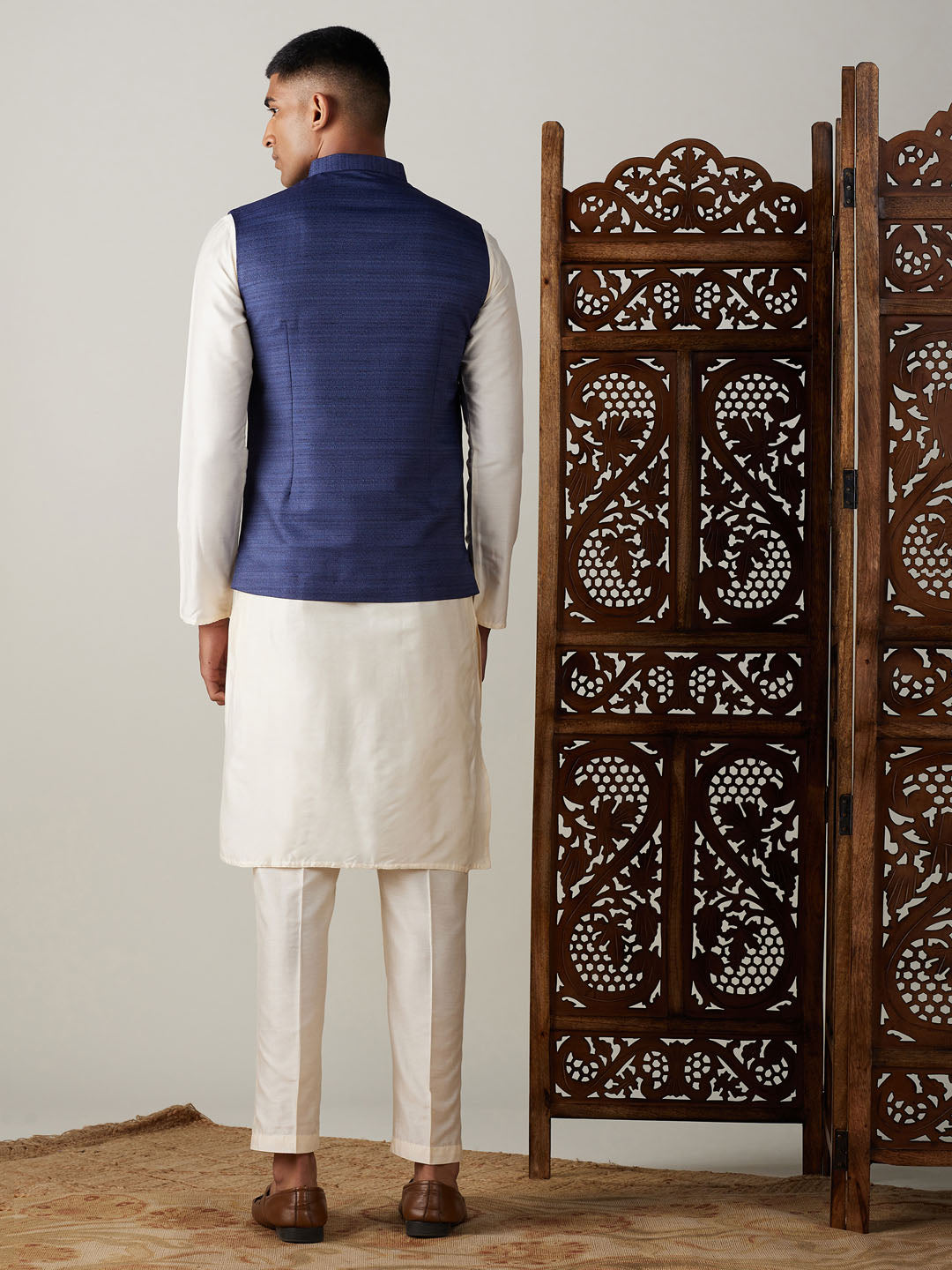 Sarvati Navy Blue Cotton Blend Solid Nehru Jacket With Cream Kurta And Pant Set