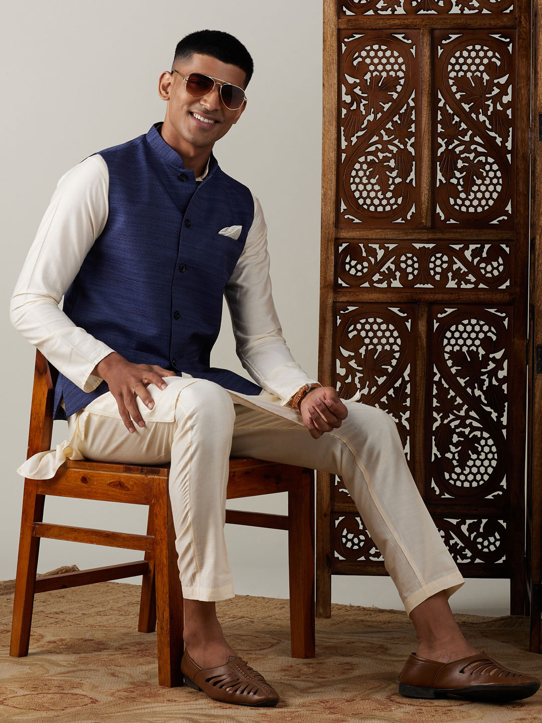 Sarvati Navy Blue Cotton Blend Solid Nehru Jacket With Cream Kurta And Pant Set