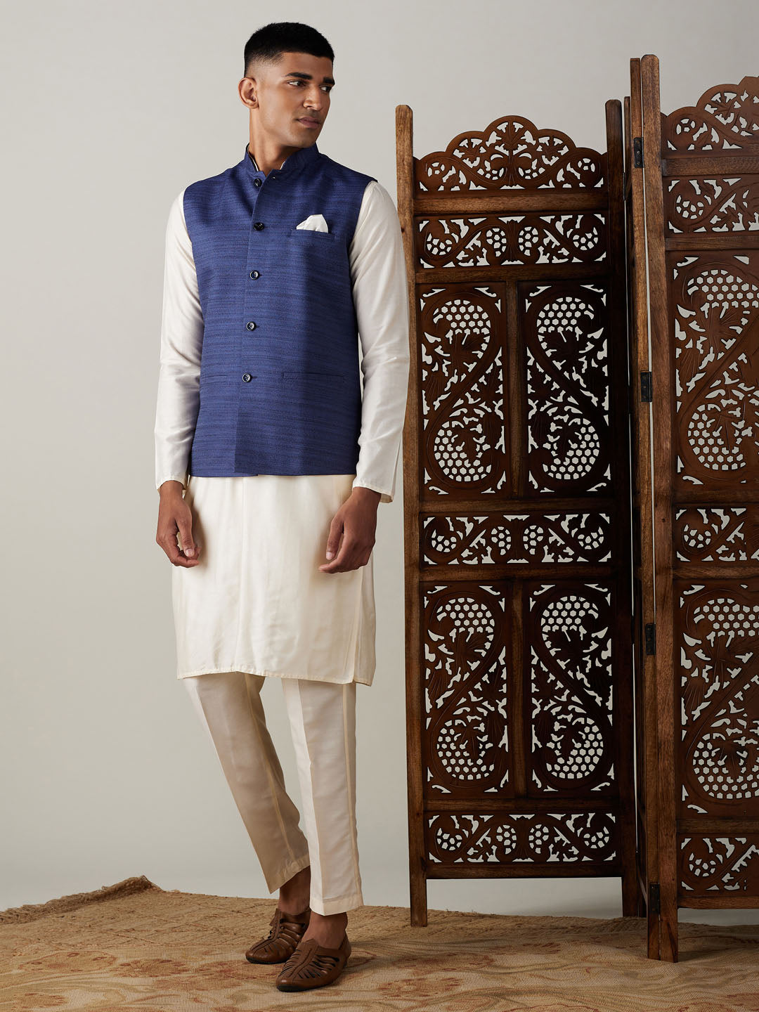 Sarvati Navy Blue Cotton Blend Solid Nehru Jacket With Cream Kurta And Pant Set