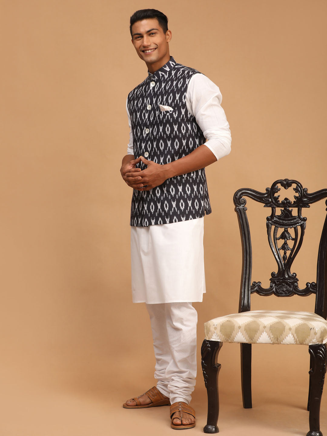 Sarvati Men's Black Ikkat Printed Cotton Nehru Jacket With White Kurta And Pyjama Set