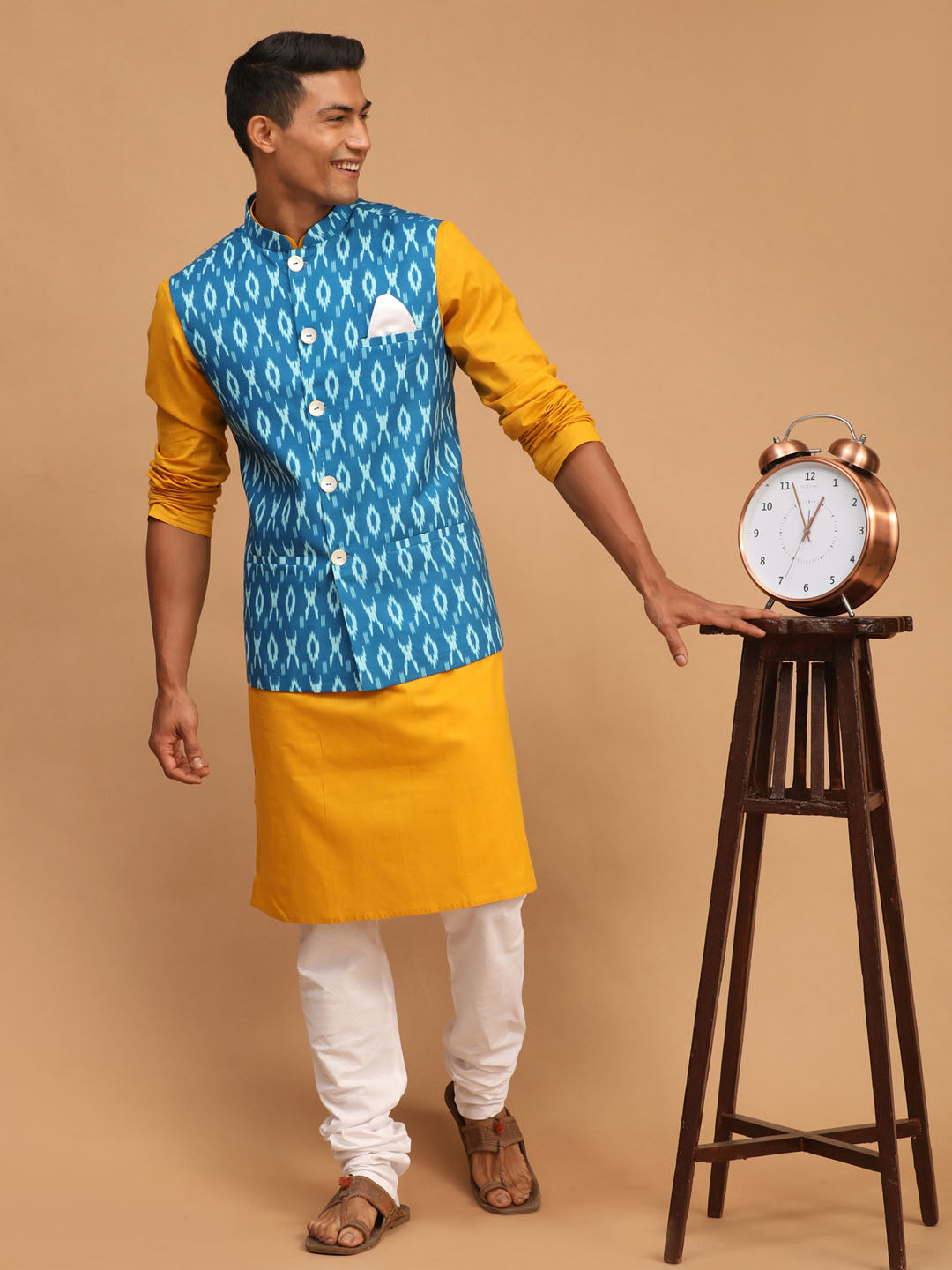 Sarvati Men's Turquoise Ikkat Printed Cotton Nehru Jacket With Mustard Kurta And White Pyjama Set